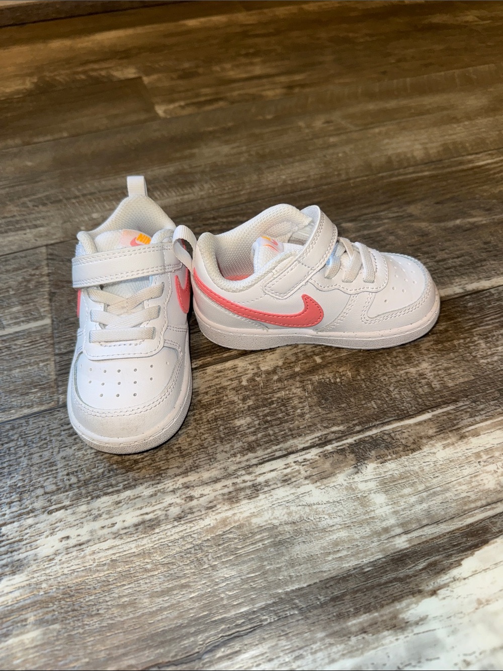Nike Kids White Sneakers with Coral Pink Swoosh